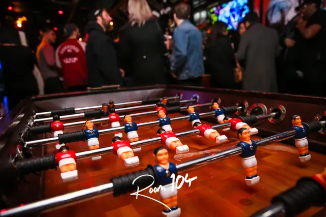 Close-up of the foosball table at Room 104