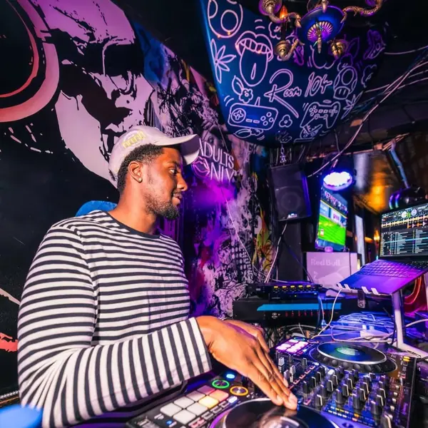 DJ in the booth under purple light