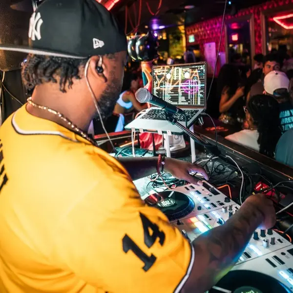 DJ mixing on the decks at Room 104